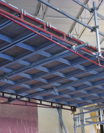 Scaffolding spans pool to paint ceiling